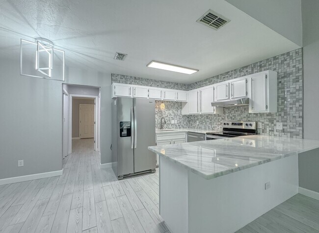 Building Photo - MODERN! Walk to FSU 2/2 w/ Marble Counters, Stainless Steel Appliances, & Privacy Fenced Yard! Av...