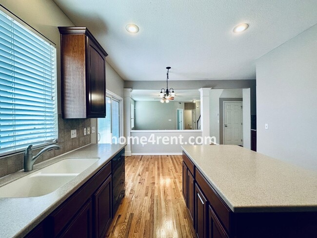 Building Photo - Wood Floors, Open Layout, Plenty of Natura...