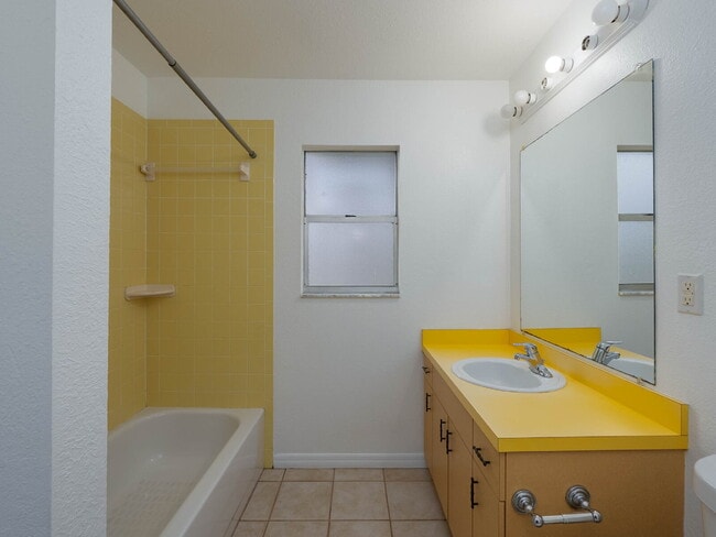 Building Photo - Recently painted 4BR/3BA home with tile floors throughout, fenced yard, detached garage, and prim...