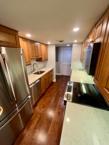 View of kitchen with hallway beyond - 77 Windward Ln