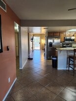 Furnished townhome flows through dining room and kitchen to living room and front door to park and l - 5050 N 81st St