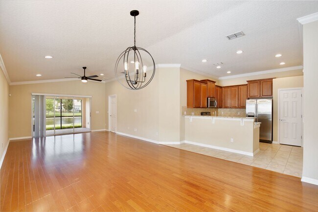 Building Photo - Gorgeous 2/2 + Den Mediterranean Villa with Waterfront Screened Patio and 2-Car Garage in the Pre...