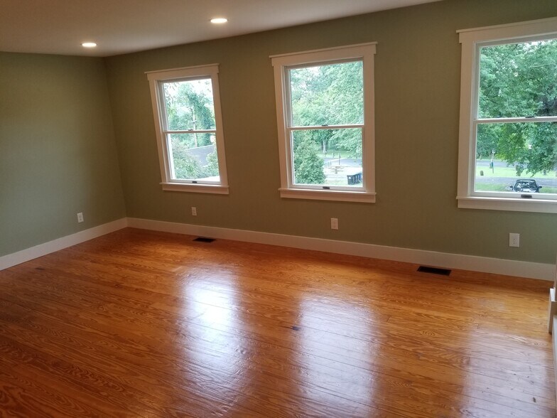 Family room repainted a neutral beig - 222 Bohemia Ave