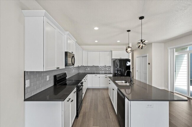 Building Photo - Brand New, Stylish 4-Bedroom Home with Vaulted Ceilings and Private Patio