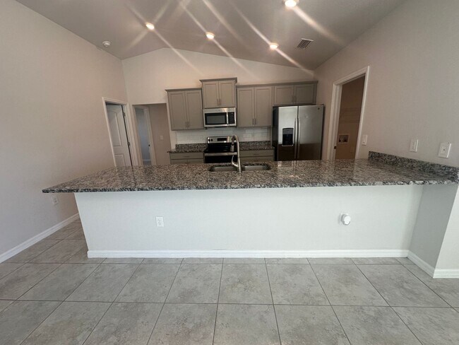 Building Photo - NE Cape Coral- Gator Circle Home- 4 Bedroom 2 Bathrooms 3 Car Garage