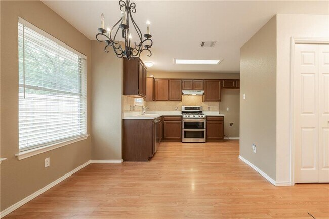 Building Photo - No Carpet! Tons of Space! Beautiful backya...