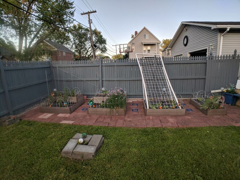 Tenants enjoy gardening together - 36 Harris Ave