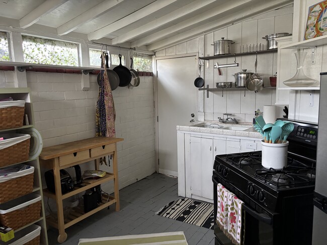 Kitchen with stove and sink - 2653 S Bedford St