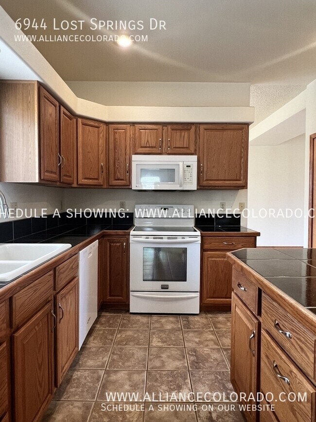 Building Photo - 6944 Lost Springs Dr