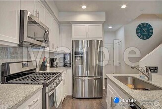 Building Photo - 2 br, 2.5 bath Condo - 2022 Quartet Loop U...