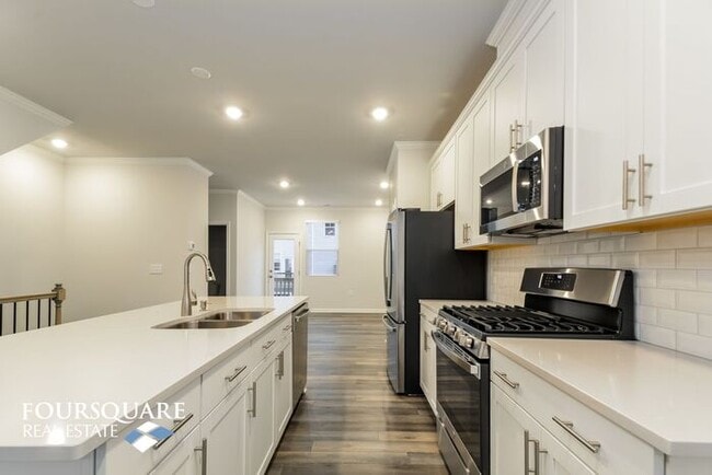 Building Photo - Modern 3-Story Townhome with First-Level B...