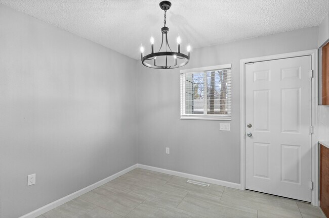 Embrace elegance in this dining space, perfect for intimate gatherings. - 5580 West 4th Avenue Townhomes