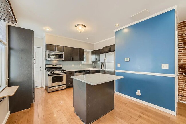 Building Photo - Charming 3 Bedroom/2.5 Bathroom Townhome in Patterson Park with Parking Pad!