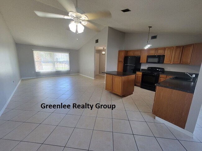 Building Photo - Relax by the water in this spacious 2-bedroom home with a 2-car garage, nestled in the highly des...