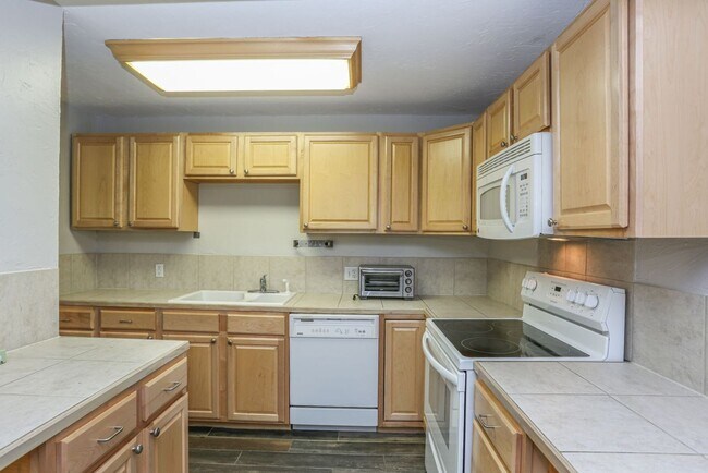 Building Photo - Walk to everything! Partially Furnished! Flexible lease terms!