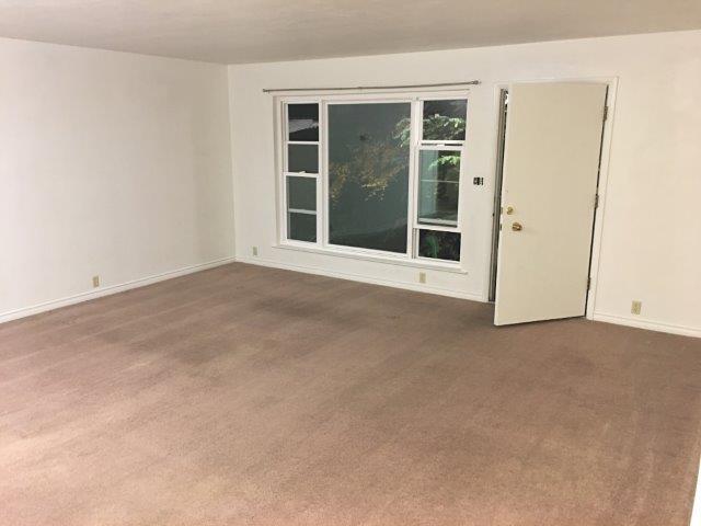 View from kitchenette to front door entrance + picture window. - 60 Cold Springs Rd, Apt