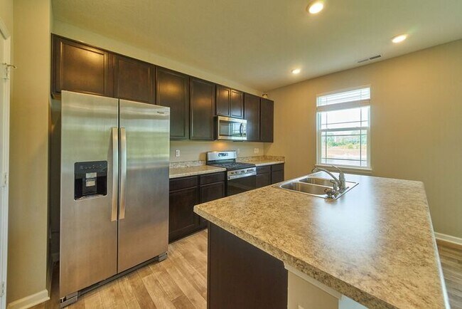 Building Photo - 4 Bedroom at Trotter's Landing in Camby With Pond View!