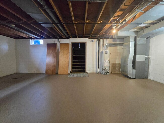 Building Photo - Updates abound at this SPACIOUS, half duplex with 3+ off-street parking spots, 3-bedrooms and 2 f...