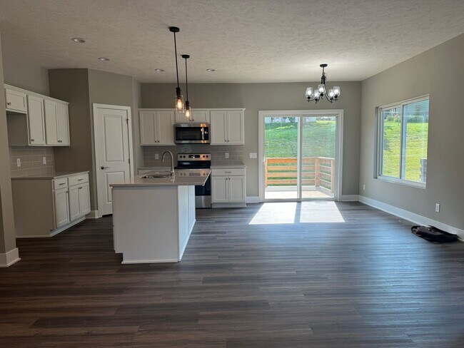 Building Photo - Luxury Bennington Townhome Ready For Move In