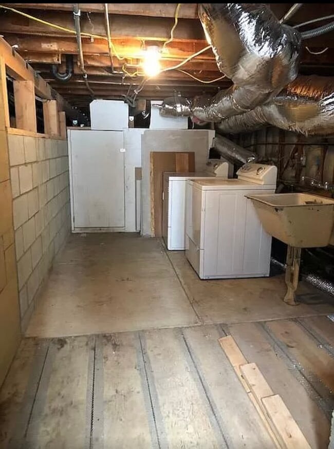 Basement with washer/dryer and sink. - 2568 N Beachwood Dr