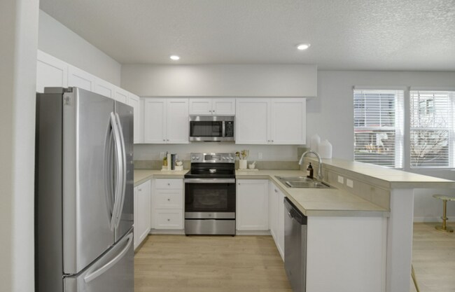 Building Photo - Modern Ground-Level Condo in River Terrace...