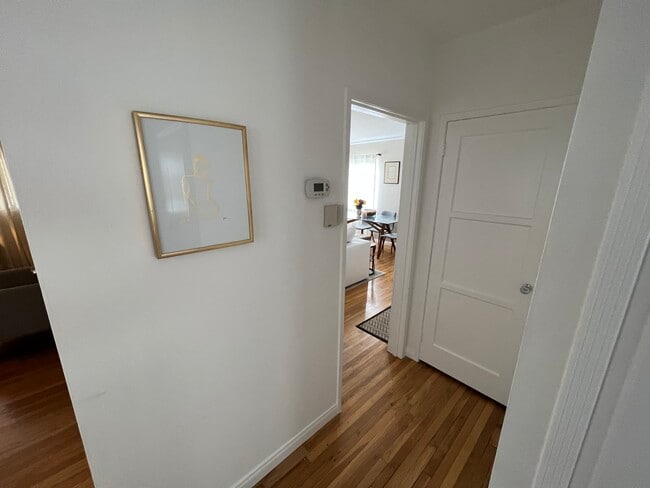 Current — hallway in front of bedroom 2 (l) and bathroom (r) facing bedroom 1 (l) living room (r) - 4222 Jasmine Ave