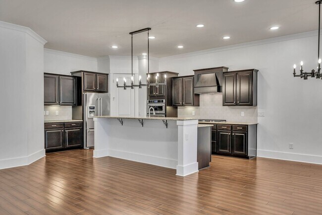 Building Photo - Beautifully maintained and move-in ready, this stunning mostly one-level all-brick home