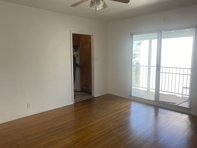 Living Room is bathed in natural light with balcony - 5622 Kinston Ave