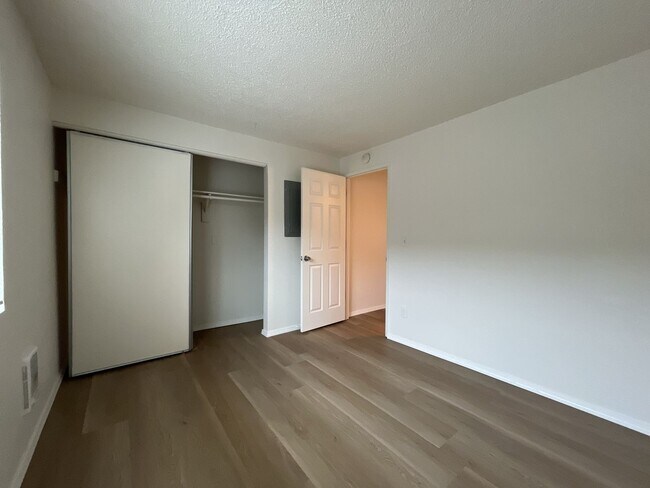 Building Photo - Inviting 2 Bedroom Home with Open Layout, Stainless Steel Appliances & Private Outdoor Retreat