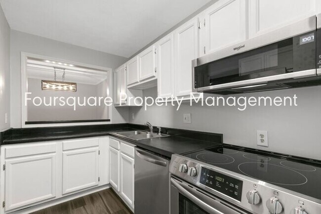 Building Photo - Charming 1st-Floor End-Unit Condo with Gas Log Fireplace, Private Back Porch & Community Pool – T...