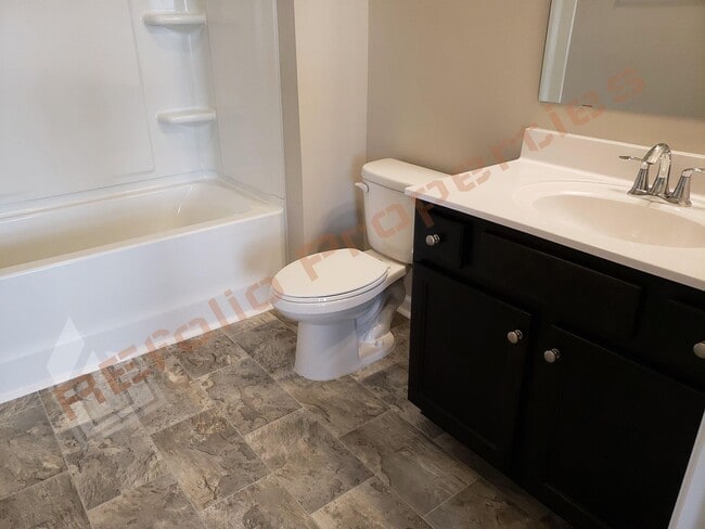 Building Photo - Beautiful Luxury 3 Story 3 Bedroom Townhome with 1st Floor Guest Suite, Attached 2 Car Garage, Co...