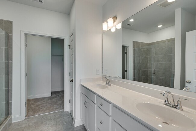Main bath off bedroom. The home has 2 full baths. - 415 Alter Ter