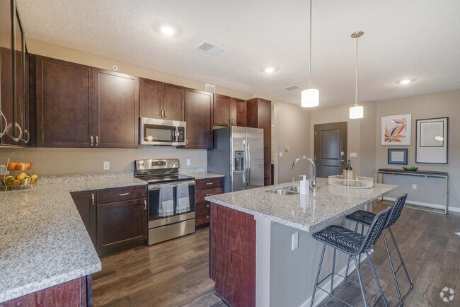 Our beautiful, modern kitchens have stainless steel appliances and plenty of counter space for all your cooking needs. - The Flats at Shadow Creek