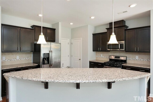 Building Photo - 3 Bedroom 2.5 Bathroom Townhome Home w/ Open Floorplan and a 2 car Garage in the heart of Morrisv...