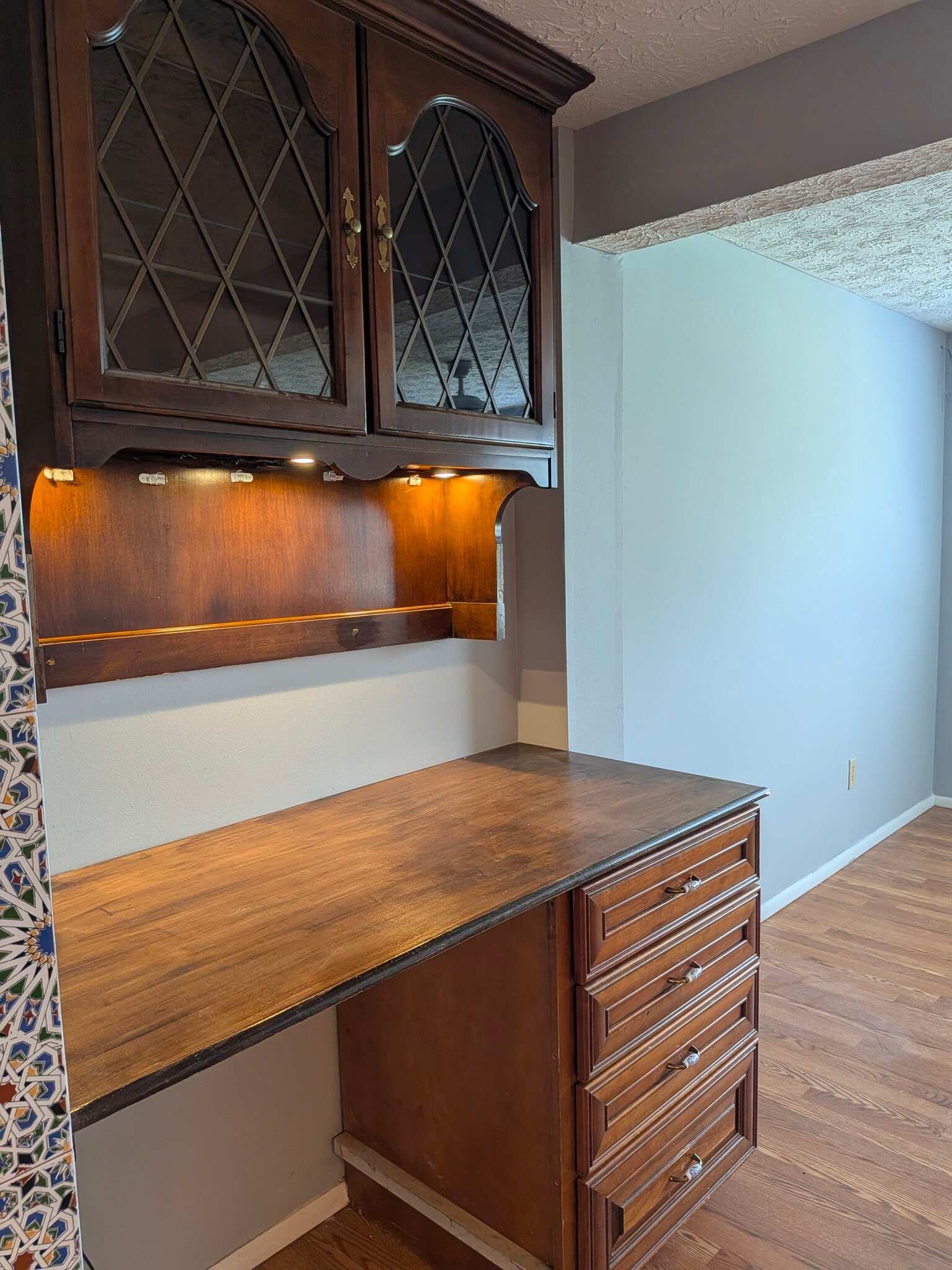 Built-in desk with ample storage in living room area - 2854 S Meade St