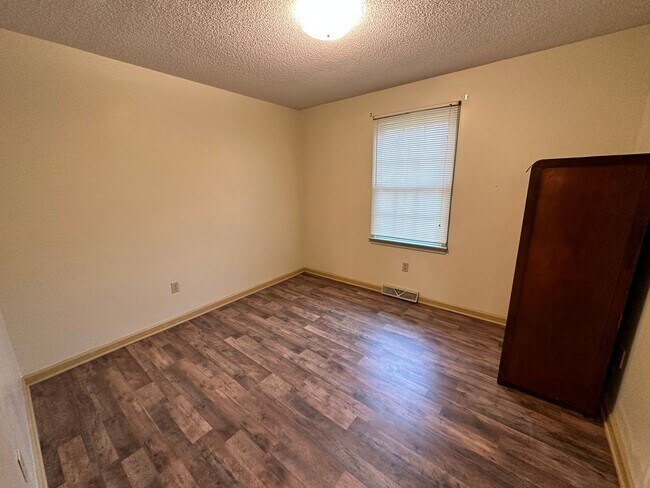 Building Photo - 4-Bedroom Brick Home with Full Unfinished ...