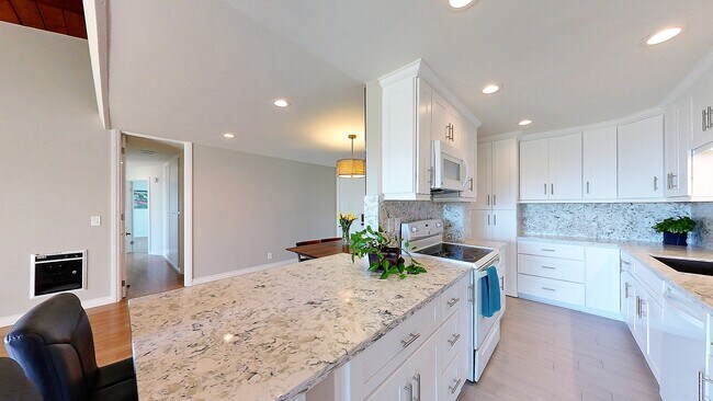 Kitchen looking into hallway leading to bedrooms - 6542 Ocean Crest Dr