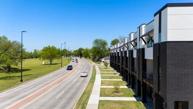 Building Photo - Discover modern elegance in the newly constructed Edgewater Condominiums, a boutique community fe...