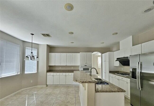 Building Photo - GATED SUMMERLIN HOME | 5 BEDROOM + DOWNSTAIRS DEN | 3-CAR GARAGE