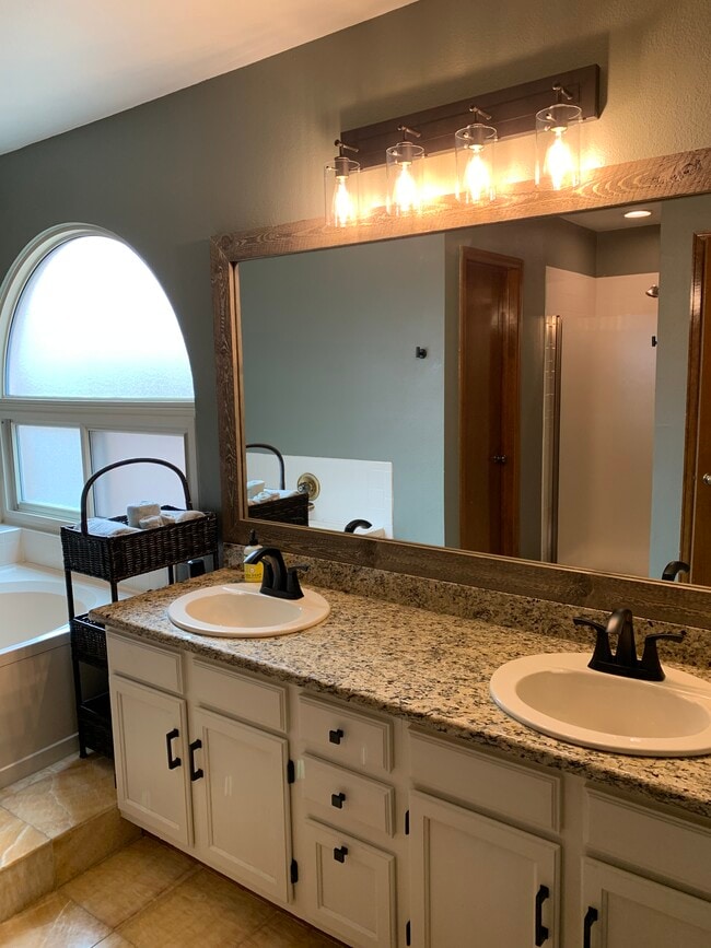 Primary suite bathroom - 7230 Native Cir