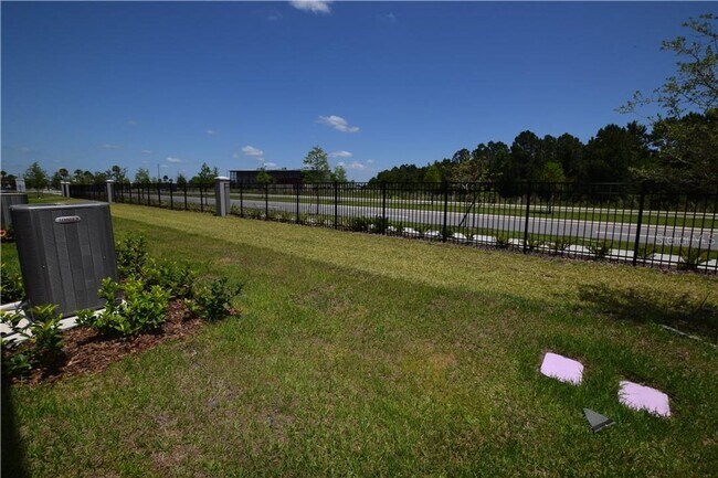 Building Photo - Like New 4/3 Townhome in Gated Community W/ Community Pool