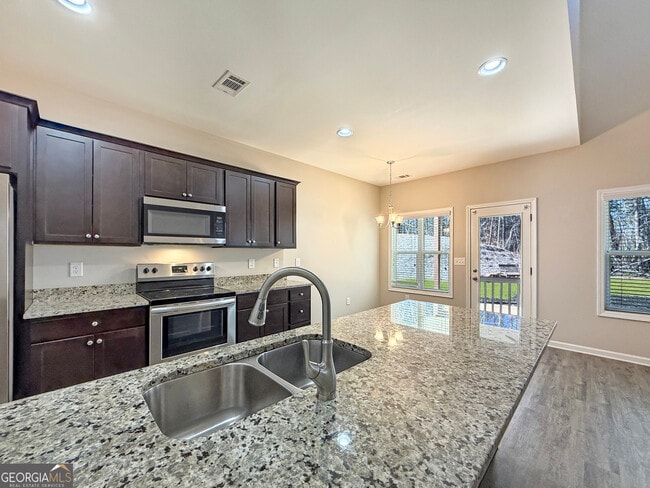 Building Photo - 6369 Woodland Station Dr