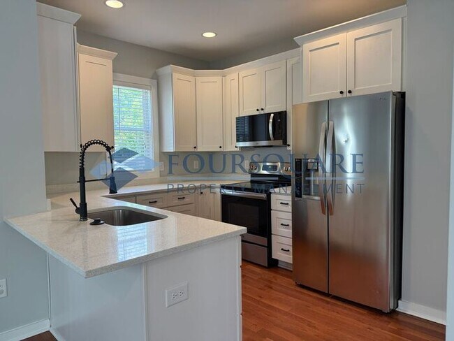 Building Photo - Modern 3-Bed / 2.5-Bath Home with Granite Kitchen, Fenced Yard & Private Balcony – Walkable to Do...