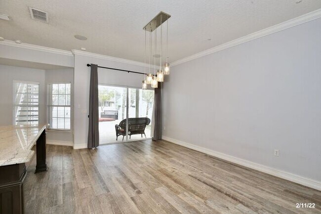 Building Photo - Luxurious 4/3 Waterfront Home with an In-ground Spa, an In-law Suite and a 2 Car Garage in the Hi...