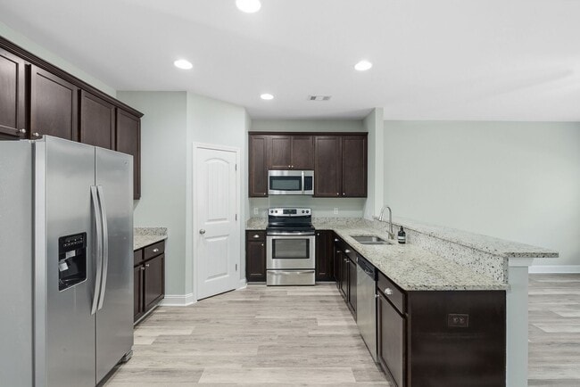 Building Photo - Charming 3 Bedroom Townhome with Private Patio & Fenced Backyard