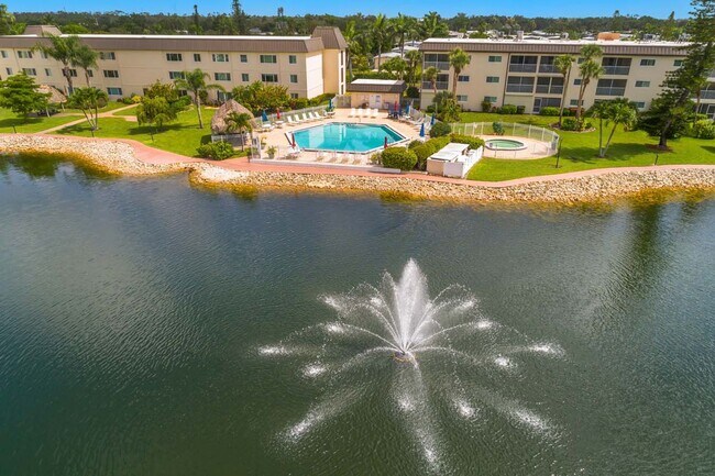 Building Photo - AVAILABLE NOW! Furnished Ground-Floor End Unit | Lake & Pool Views | Minutes to Marco Island & Do...