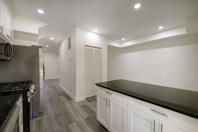 Building Photo - Charming & Renovated Petworth Rowhouse with Parking -  Available Now!