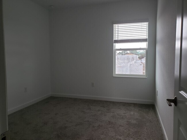 Building Photo - Bridgewalk Corner Lot Home with Wooded View and Solar Panels