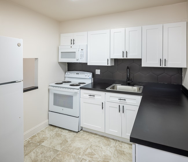 Updated Kitchen with Modern Finishes in ALL UNITS! - Riverview Place