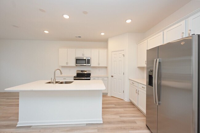 Building Photo - **BE THE LUCKY ONE TO LIVE IN THIS 2024-BUILT BRICK TOWNHOME IN THE VILLAS AT REGAL SQUARE FEATUR...